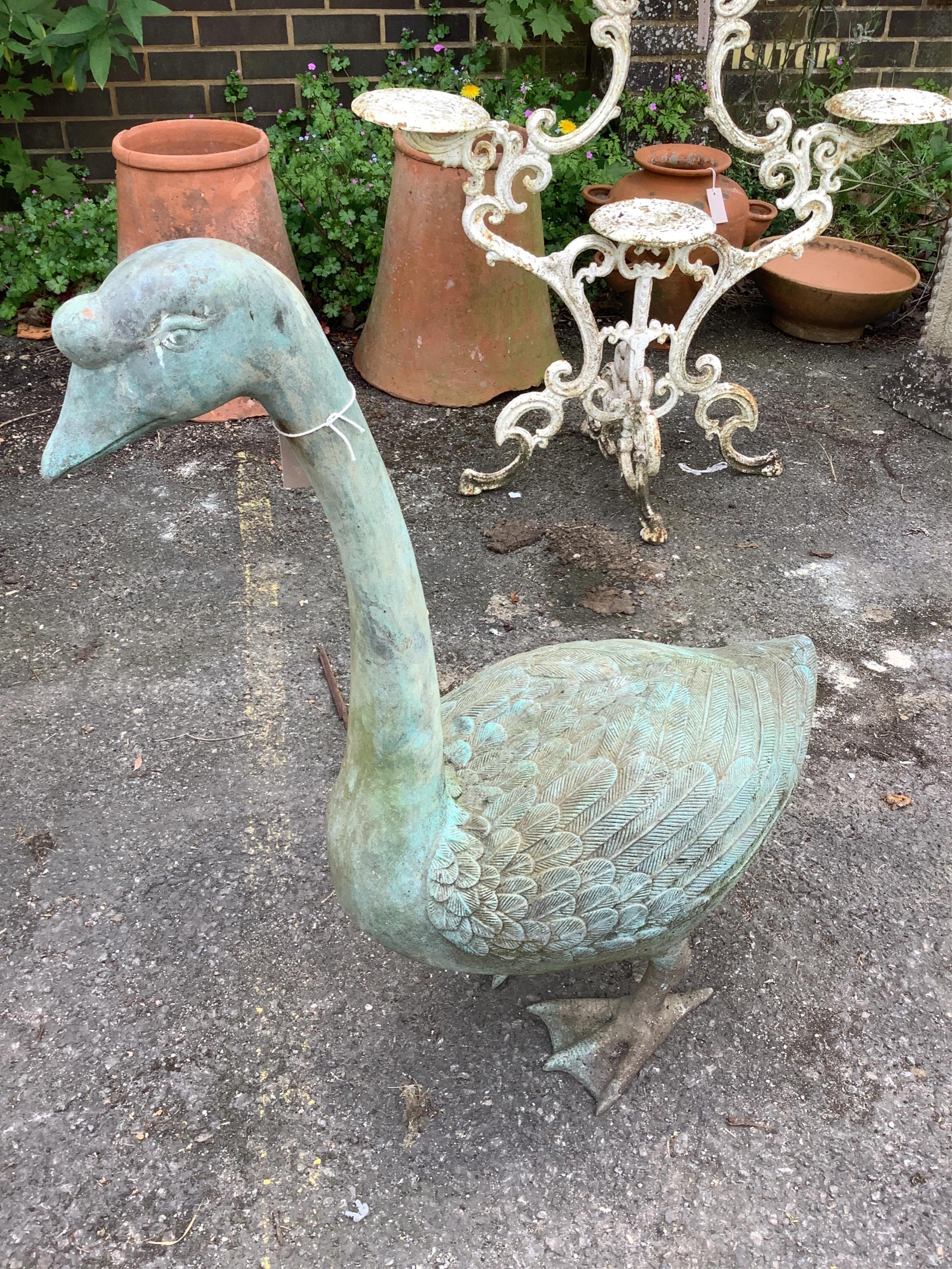 A cast patinated metal model of a goose, height 76cm